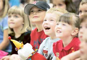 Smiles from a young crowd at a previous Phil Jones Magic Show.