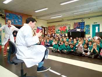 Pupils enthralled by Huw and Pugh.