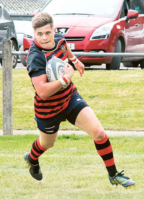 Ashley Sutton goes over in the corner for Tenby’s opening try.