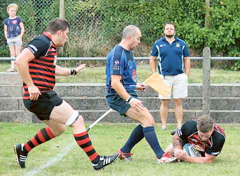 Andrew Cooke secures a bonus point win for Tenby as he touches down.