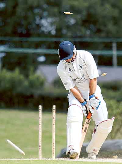 Haverfordwest’s Ben Field has his middle stump removed by Tom Murphy.