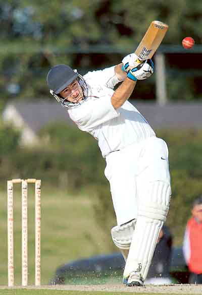 Cresselly captain Phil Williams takes the fight to Haverfordwest in the first innings.