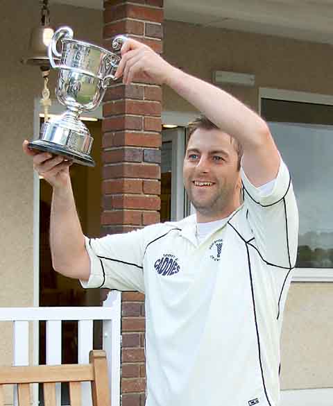 James Morris of Haverfordwest lifts the Alec Colley Cup.