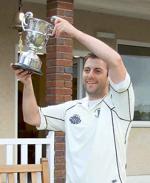 James Morris of Haverfordwest lifts the Alec Colley Cup.