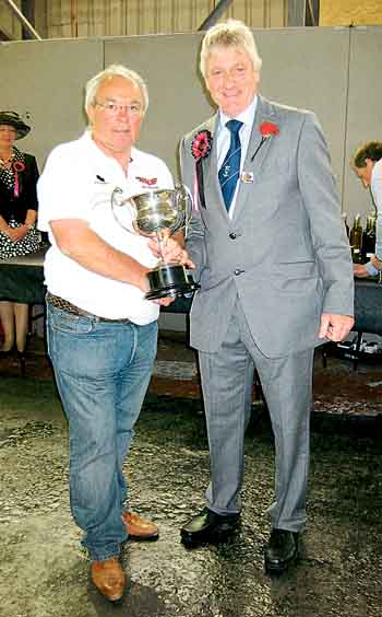 Neil Thomas receives the Clr. Claude Davies Perpetual Challenge Cup for the Best Colour Print in Show from show president