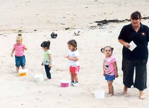 Toddlers prepare for their race on sports day.