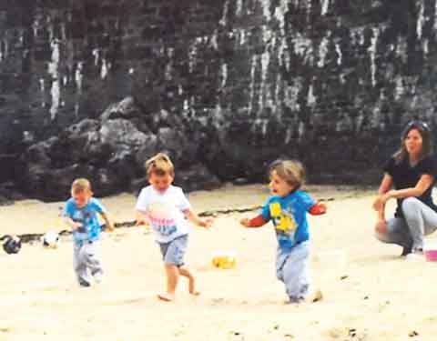 Sports day runners on harbour beach.