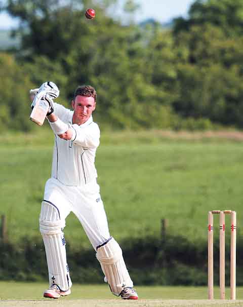 A big hit! Paul Davies smashes a towering six into the gardens for Whitland as he contributed a useful 30 runs in his side’s total of 153.