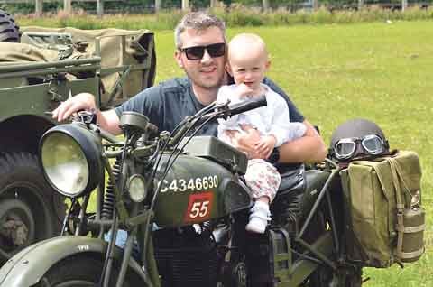 Stephen Edwards and 15-month-old Elizabeth with her dad’s 1940 BSA motorbike.