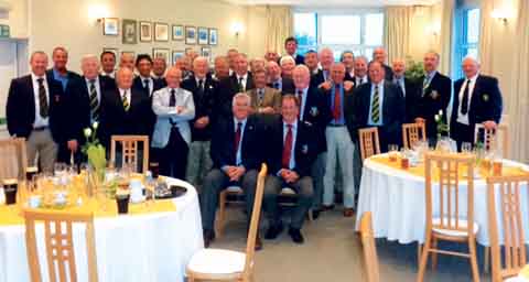 Club captains Tony Lovell, of Langland Bay, and Richard Ormond, of Tenby, seated with members of both teams standing.
