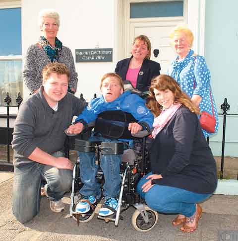 Gregory Mott on holiday in Tenby with his carers Gareth Jones and Kimberley Bennett, Elizabeth Sleight from the Harriet Davis Trust and Soroptimists Pam Maggs and Anne Kelly.