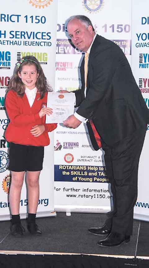 Caera Lewis, Pembroke Dock Community School, being presented by Mr. Andrew R. T. Davies, AM.