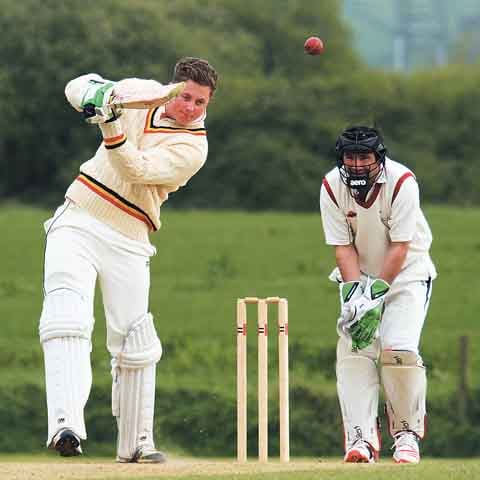 Lewis Hicks hits another boundary for Carew.
