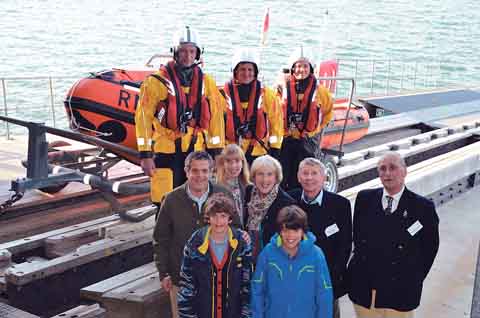 RNLI Angle’s new £41,000 inshore lifeboat was officially named and dedicated at a champagne ceremony last Thursday evening. The D class lifeboat SuperG II (D-776) has been funded by The Coward Endowment, a small family trust established by the late Charles Coward in 1965. The new lifeboat was officially handed over to the RNLI by Charles Coward’s son, Clive, of London. He was accompanied by his wife Frances; daughter and son-in-law, Tammy and Zino Pece, of Swansea, and grandsons Oli and Tom Pece. Indeed, it is Oli and Tom who are the inspiration for the lifeboat’s name - ‘SuperG’ (Super Grandad) being their name for grandad Clive. Clive and Frances Coward, their daughter and son-in-law, Tammy and Zino Pece and grandsons, Oli and Tom Pece, are seen above with RNLI Angle lifeboat operations manager John Allen-Mirehouse, and the volunteer crew of SuperG II, Adam Stringer (helmsman), David Dillane and Sarah Lunn.