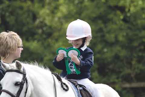 Lottie Lacy with her rosettes.