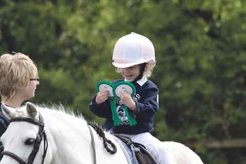 Lottie Lacy with her rosettes.