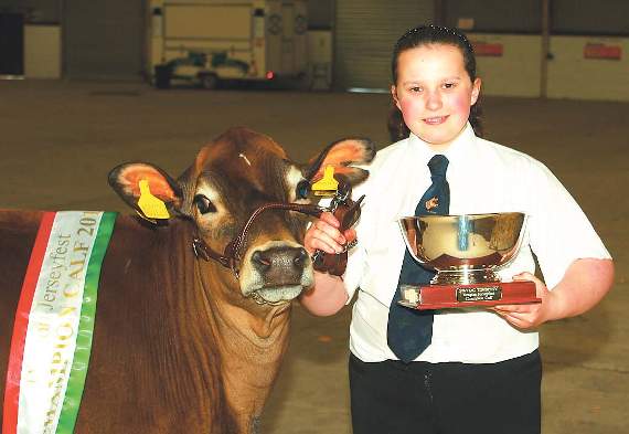 Elan Thomas with her champion heifer calf.