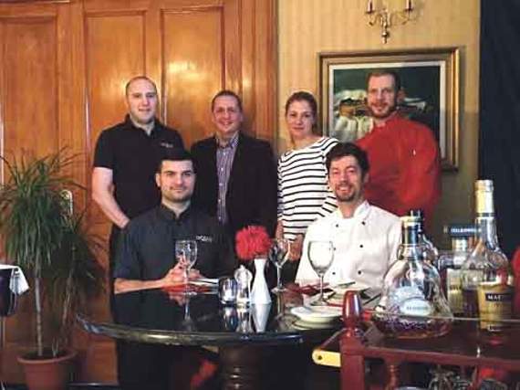 A warm welcome from the staff of Tenby’s Ocean Restaurant, opening on Friday. From left to right: Cornel, Bibi, Vio, Andrea, Bogdan, and Alex.