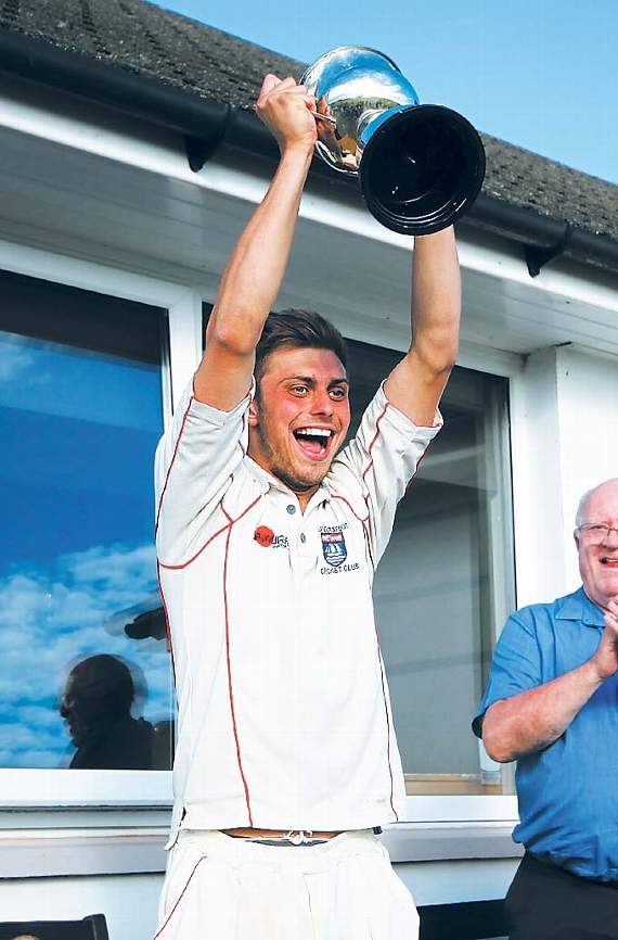 Saundersfoot captain Sam Franklin holds the Alan Brown Trophy aloft. Pic. Susan McKehon