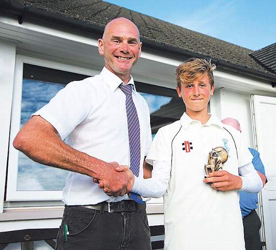 Man of the Match Tom Mansbridge receives his trophy from tournament sponsor Paul Webb, of Tavernspite Garden Centre. Pic. Susan McKehon