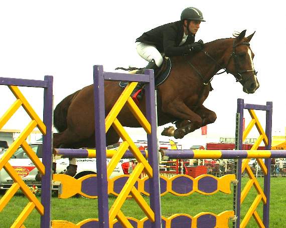 International showjumper Paul Crago competing successfully on Dawn Cooley’s Valentino.
