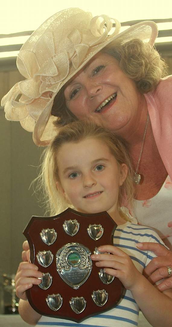 Anne Hewings presents the craft award for four-six-year-olds to Poppy Doward.