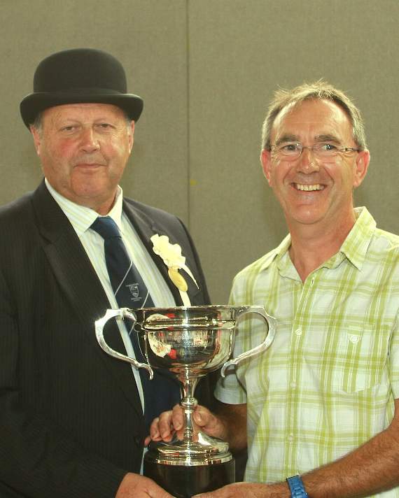 President-elect Richard Cole congratulates Richard Davies on gaining most points in the horticultural section for the 15th successive year.
