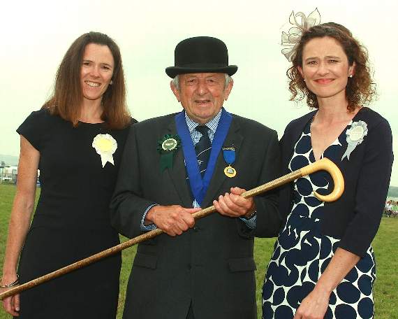 President Dennis Reed with daughters, Georgina and Lois, after being presented with the traditional stockman’s stick.