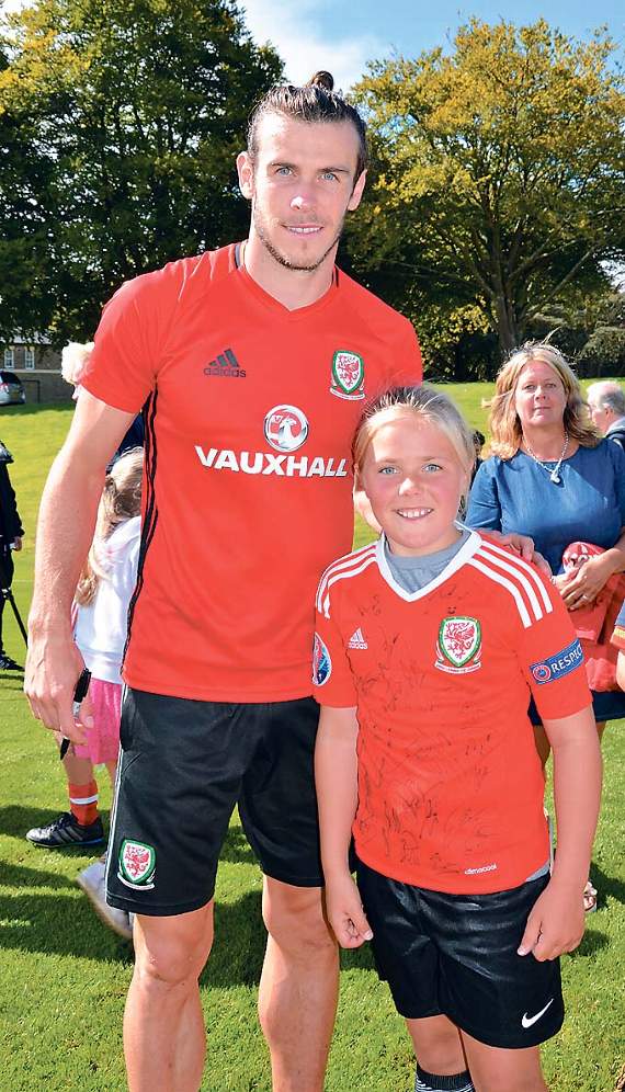 Gareth Bale with Mabli, who plays for the newly-established St. Florence Girls AFC U10s.