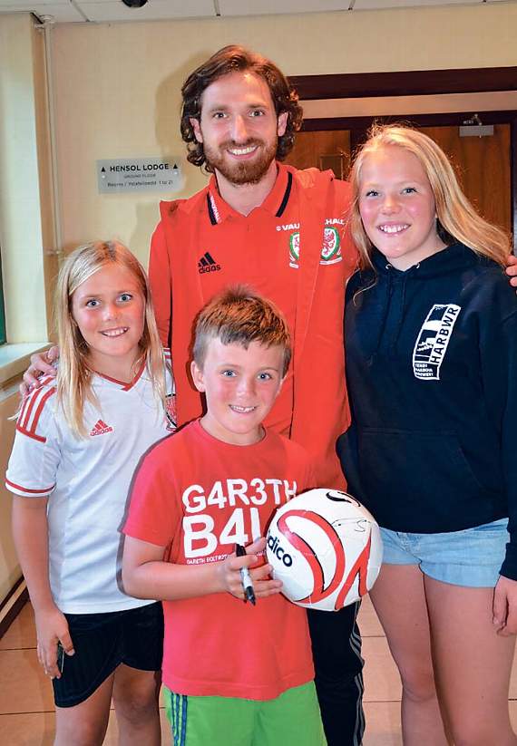 Joe Allen with Tenby’s Mabli, Madoc and Olwen Evans.