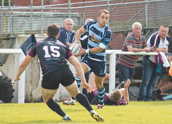 Nick Gale about to evade Bedlinog fullback Dan Parry. Pic. Elwyn Davies