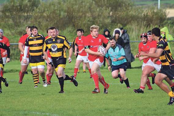 Seamus Wiseman and the Pembroke pack breaking out of defence.