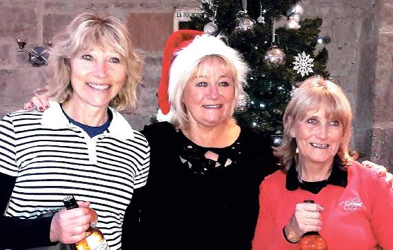 Lady captain Ann with Christmas Spirit winner Rosie Moore (left) and second Heather Thorne.