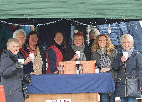 Cheers! Ladies of the social committee sampling the warming delights of their own mulled wine stall! Pic. Elwyn Davies