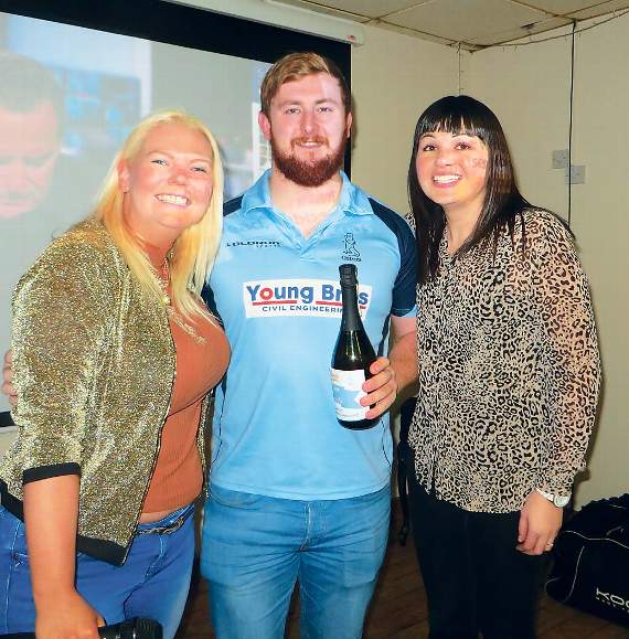 The Ken Morgan Architects Balcony Suite match sponsors Oil 4 Wales man-of-the-match, flanker Sean Jenkins, gets a bottle of G. D. Harries Bubbly from Angharad Jones and Cerys Harry. Pic. Stephen Thomas