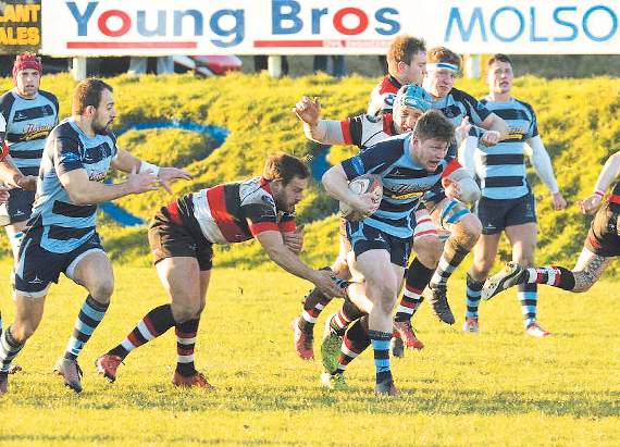 Liam Hutchings attempting to get clear from Pontypool tacklers. Pic. Elwyn Davies