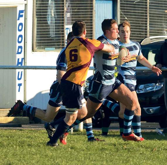 Liam Hutchings racing forward with Jack Parkinson supporting on his shoulder. Pic. Elwyn Davies
