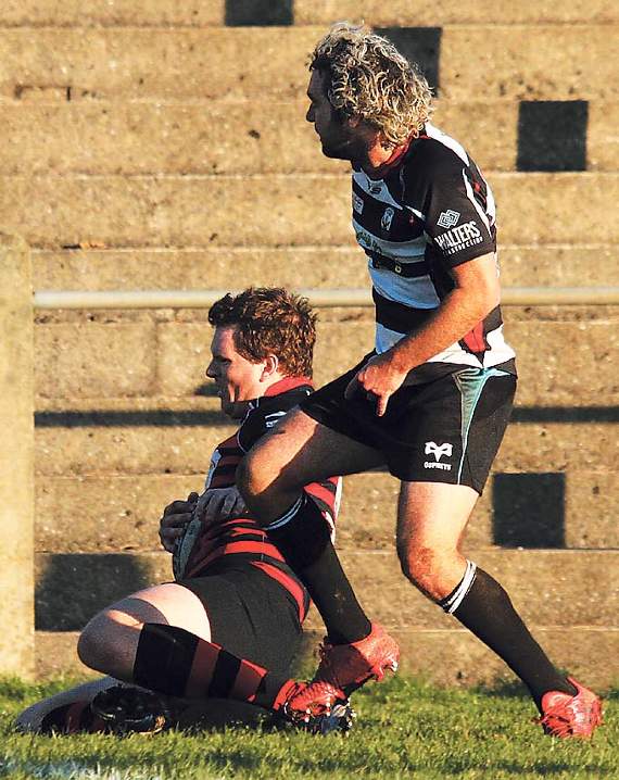 Toby Smith rounds off the best attacking move of the match to score another of Tenby’s tries. Pic. Susan McKehon