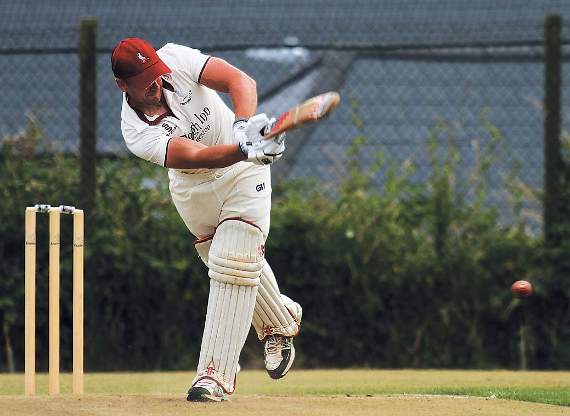 Adam Chandler strikes another boundary for Cresselly on his way to topscore of 55 against Haverfordwest. Pic. Brian McKehon