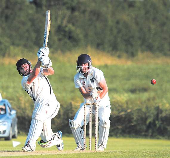 Ashley Sutton 64 not out strikes the ball to the boundary in Neyland’s victory over Whitland in the Harrison Allen semi-final. Pic. Brian McKehon
