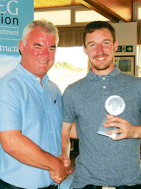 Rhys McCarley from Glynhir (right) with the Overall Best Golfer engraved memento alongside Andrew Phillips from Carreg Construction (main sponsor).
