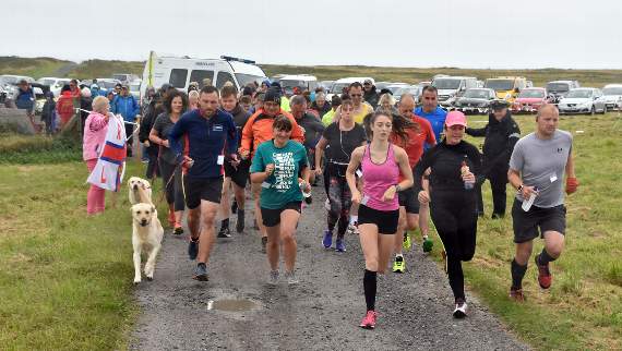 The runners head off across Castlemartin Range.