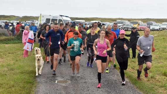 The runners head off across Castlemartin Range.