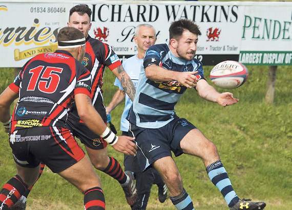 Narberth’s Richard Rees receiving the ball whilst being closely monitored by Rhydyfelin defence. Pic. Elwyn Davies