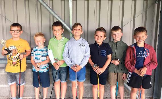 The boys lined up after their golf session.