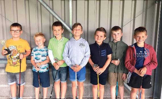 The boys lined up after their golf session.