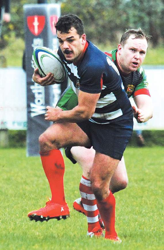 Jack Guerreiro, who scored Tenby’s opening try, slips the tackle. Pic. Susan McKehon