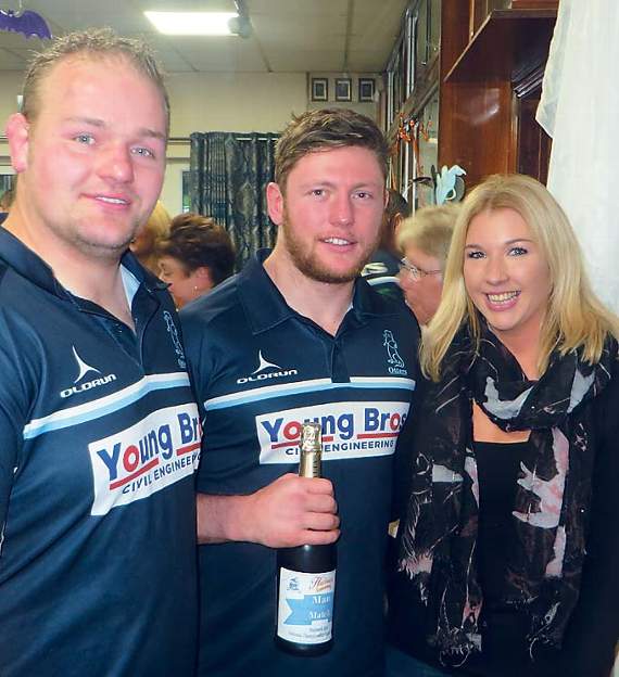 The Hywel Griffiths Plant Hire Balcony Suite match sponsors The Glen, Haverfordwest, man of the match was winger Liam Hutchings. Here seen in the middle with Tom and Helen Slater, of The Glen, receiving a bottle of G. D. Harries bubbly. Pic. Stephen Thomas