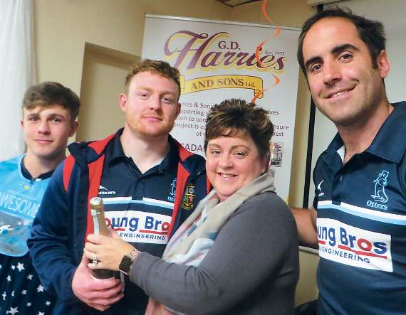 The Otters Holt sponsors G. D. Harries and Sons Youth man of the match was split between flanker Leon Whaller and centre Geraint Powell. They were given a bottle of G. D. Harries bubbly from Janet Phillips, of G. D. Harries, and coach James Merriman. Pic. Stephen Thomas