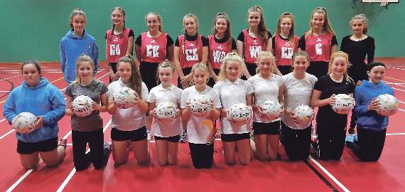 Pembroke Junior Netball Club sporting new bibs and training balls donated from the charity section.